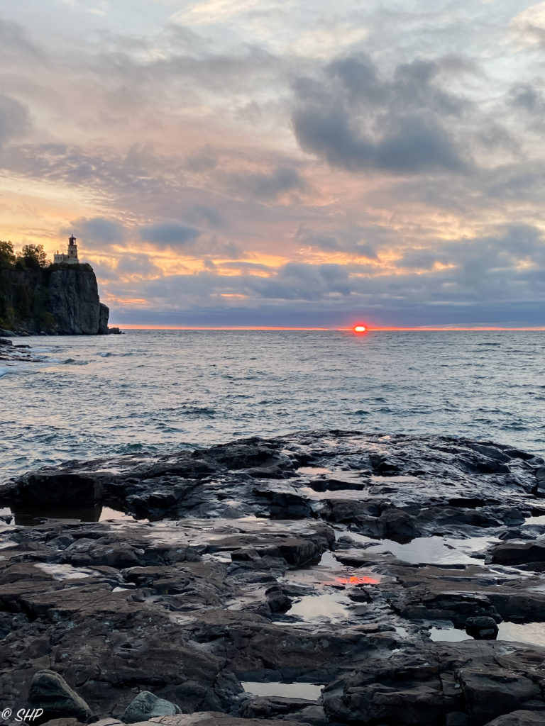 Split Rock Lighthouse with sunrise reflection