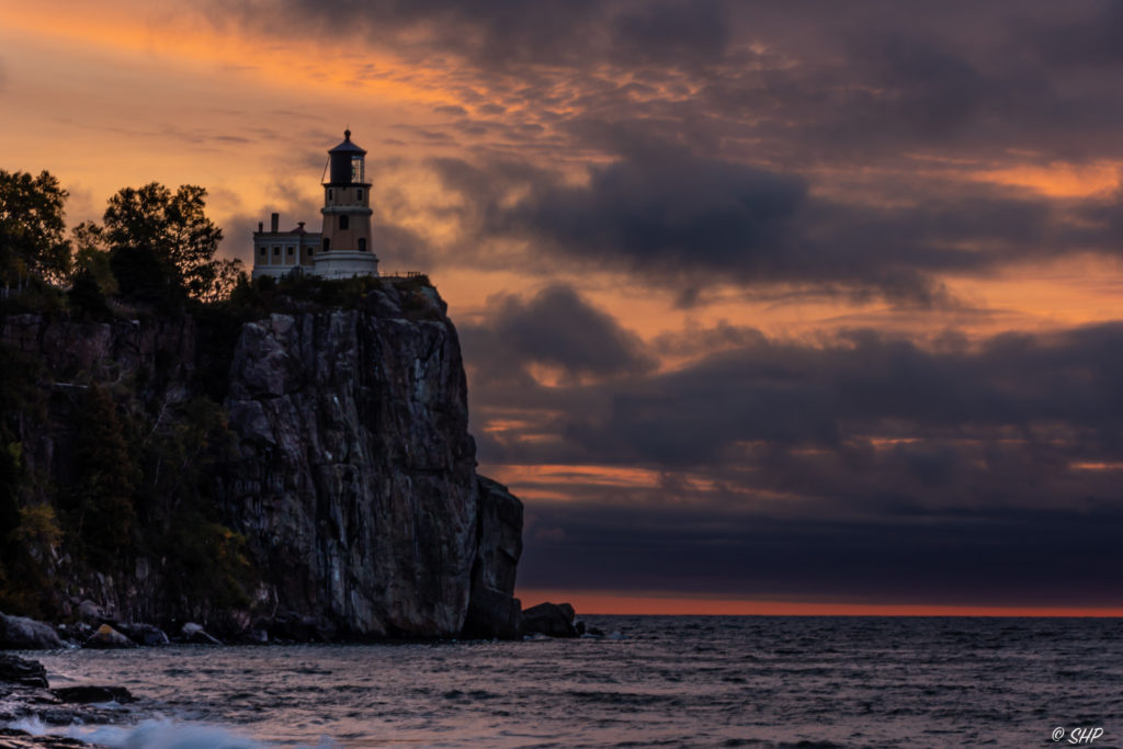 glowing skies at sunrise behind Split Rock Lighthouse