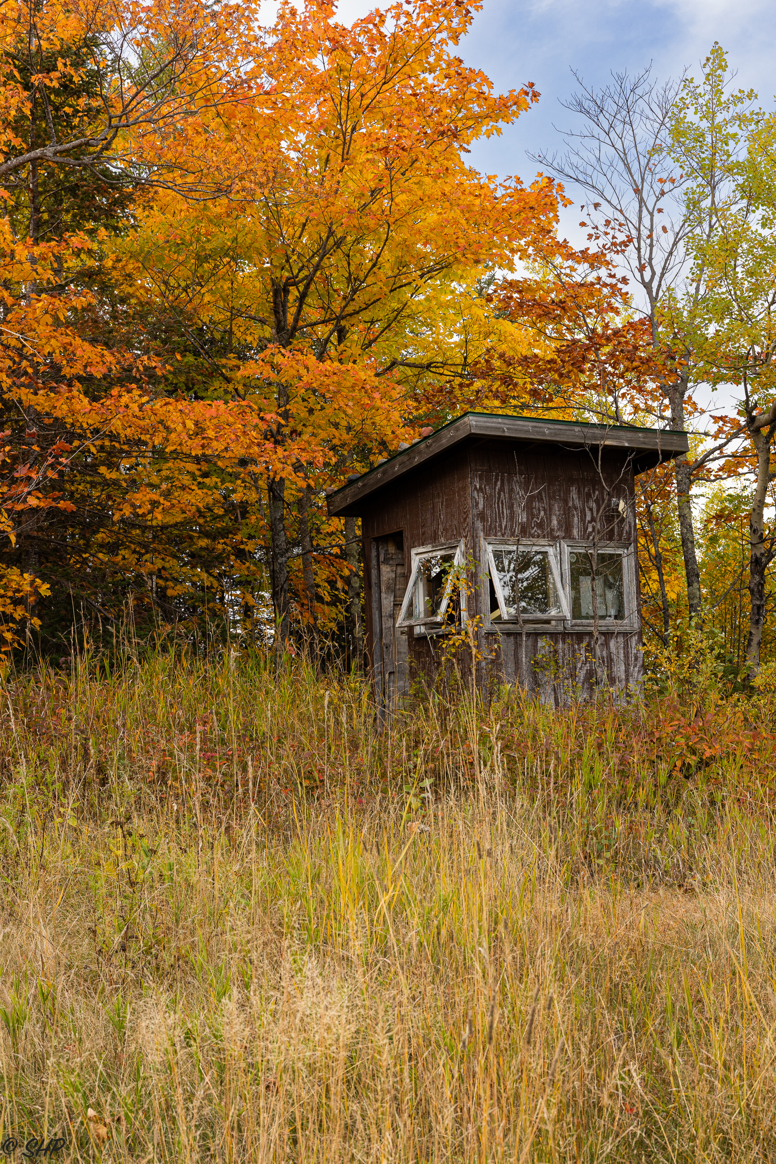 ski hut surrounded with fall color
