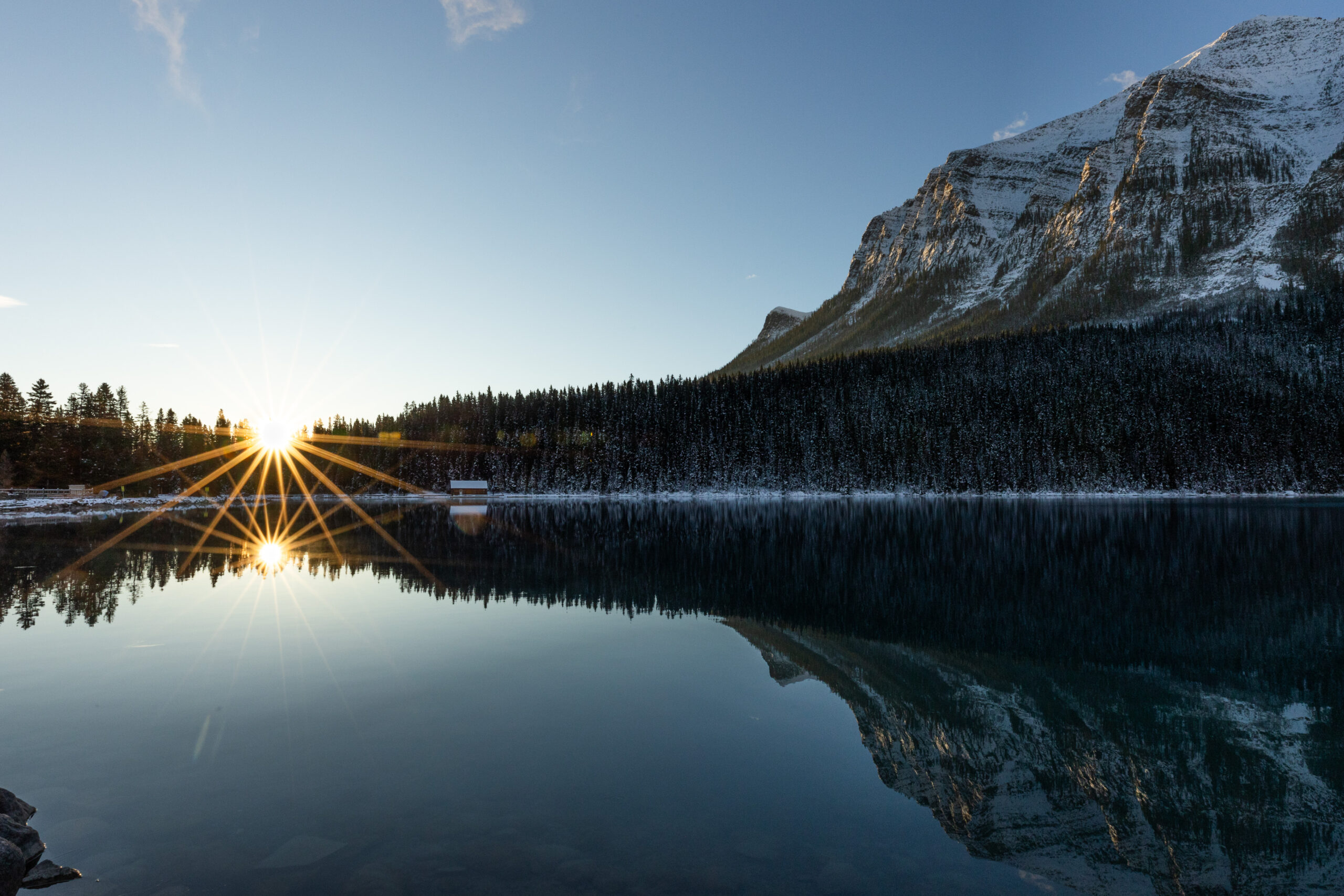 Sunrise starburst over Lake Louise, Canada